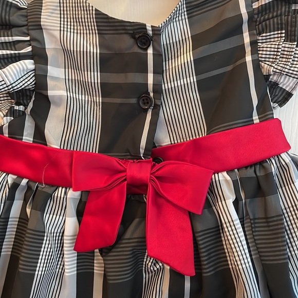 Beautiful black and white with a red sash dress - Picture 3 of 5